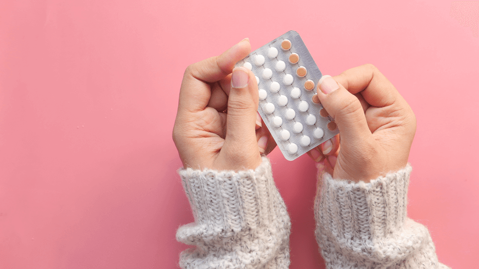 woman-holding-birth-control-contraceptive-pill-pack