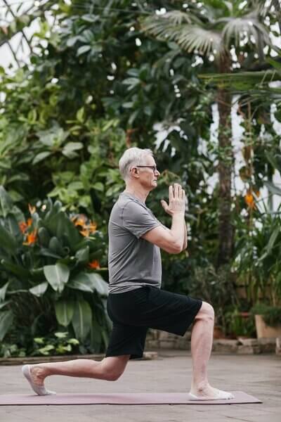 man-excercising-outside-in-his-garden