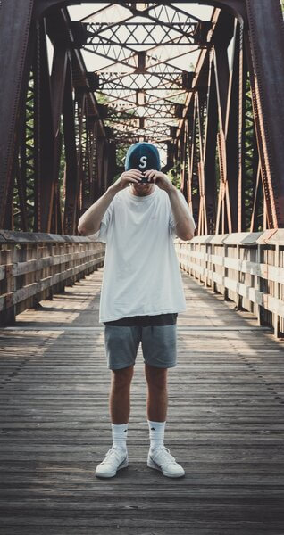 man-covering-bald-patches-with-hat