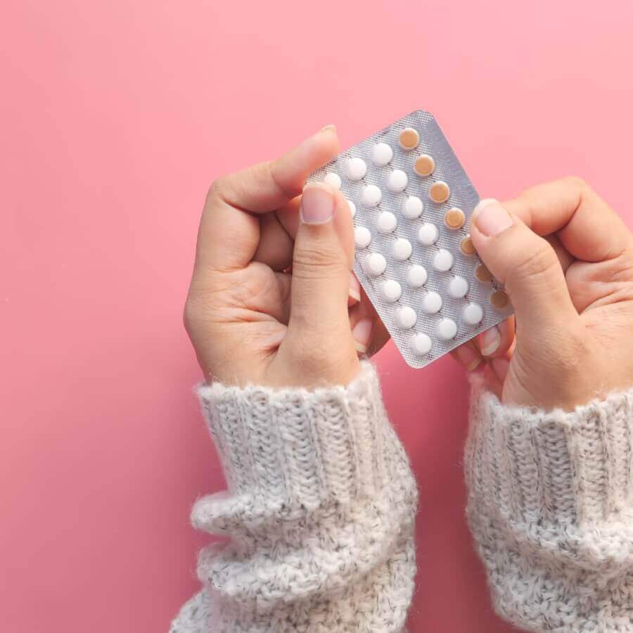 woman-holding-contraceptive-pill-packet