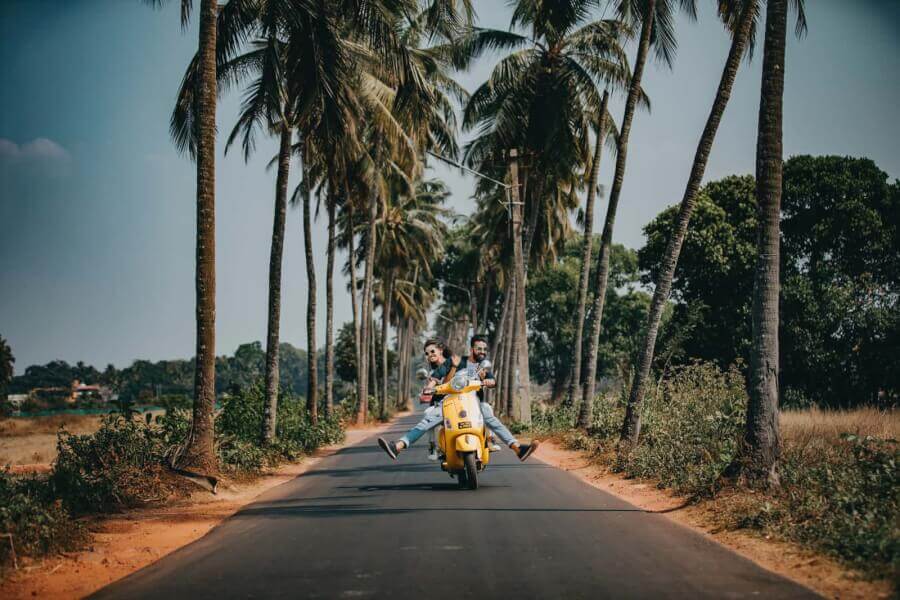 man-and-woman-driving-a-scooter