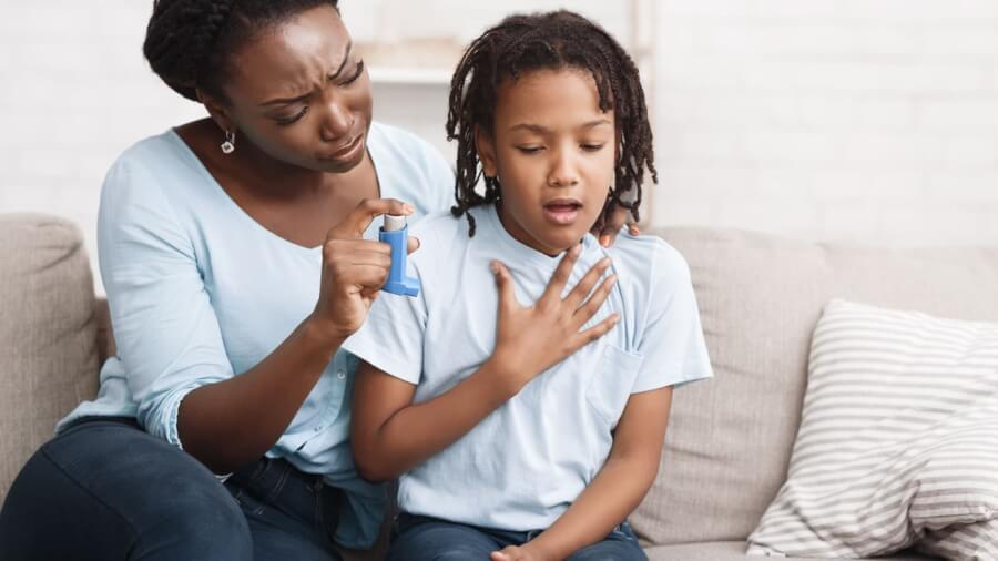 mother-helping-her-son-use-his-inhaler