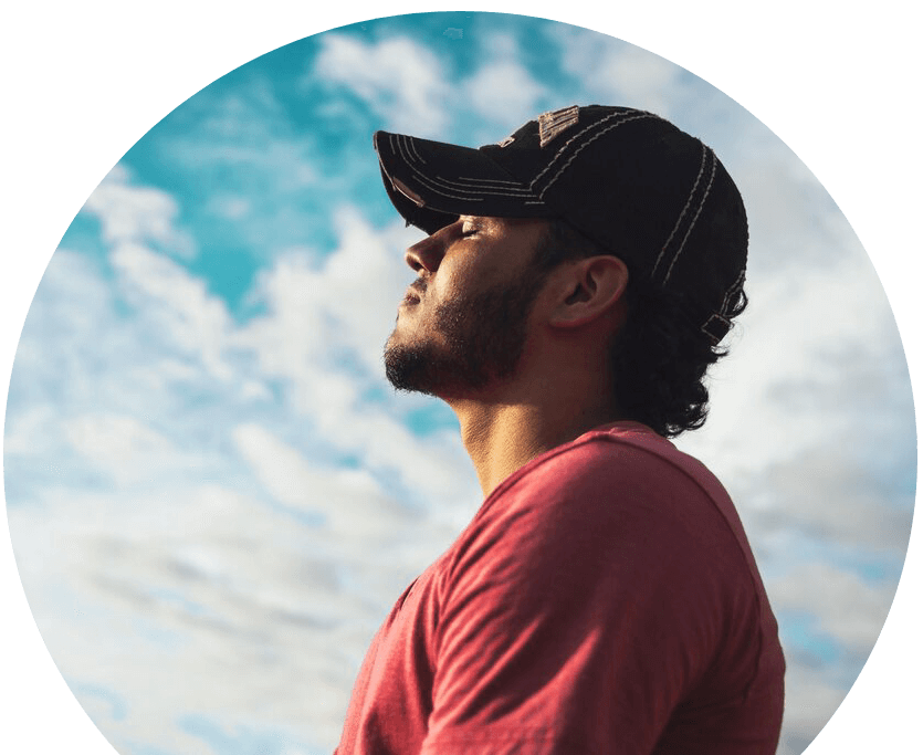 pexels-kelvin-valerio-810775-edit man-outside-taking-a-deep-breath
